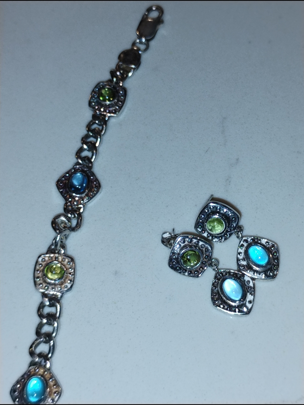 Silver Charm Bracelet with Blue and Green Gem Accents